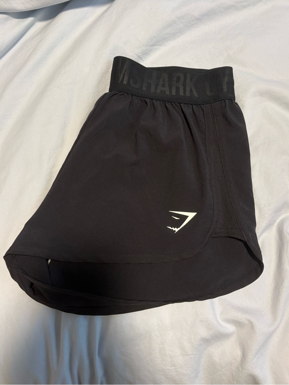 black gymshark shorts active